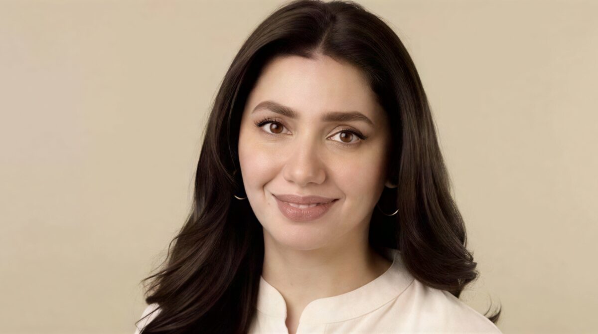 Mahira Khan smiling at a public event, representing Pakistani cinema 