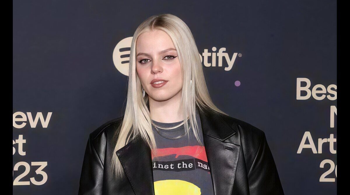 Reneé Rapp posing at a red carpet event in a stylish designer outfit in 2026 