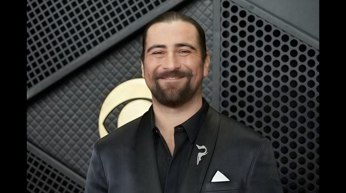 Noah Kahan performing live on stage during a concert in 2026. 