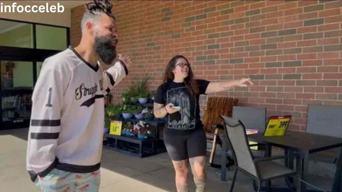 Damon Darling standing outside a store and interacting with a fan, highlighting his growing popularity and Damon Darling Net Worth 2026.