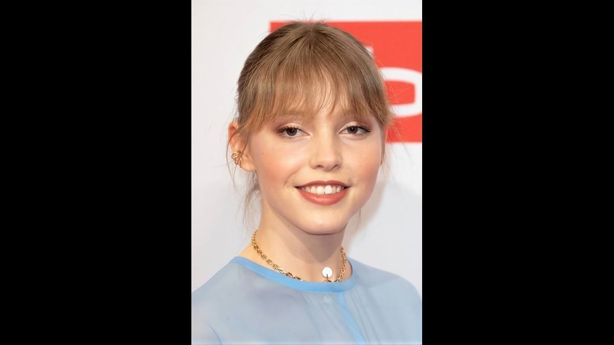 Portrait of Lina Strahl highlighting her estimated net worth, music career, and acting success in 2026.